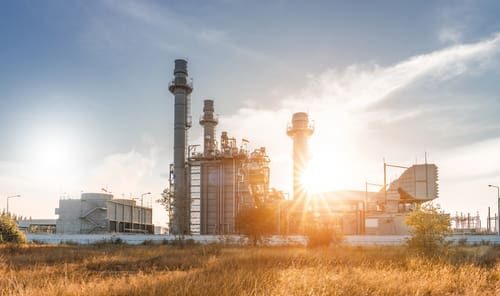 Industrial zone with heavy equipment and machinery, typical of the chemical sector.